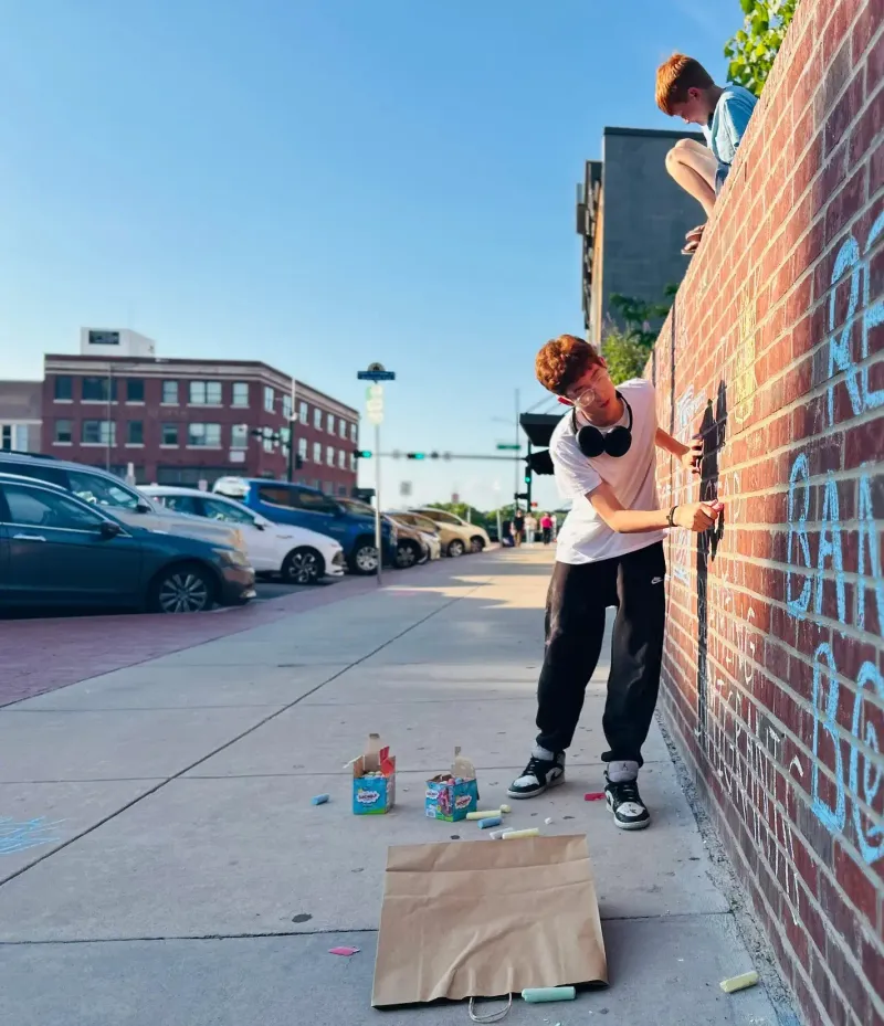 Meet the 14 Year Old Activist Behind Denton's Chalk Wall