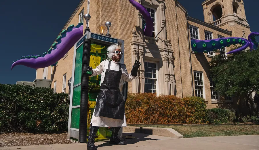 The mad scientist of 2025 standing outside of West City Hall